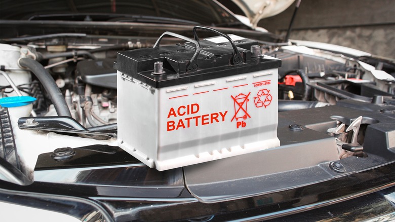 Automotive acid battery on car engine bay