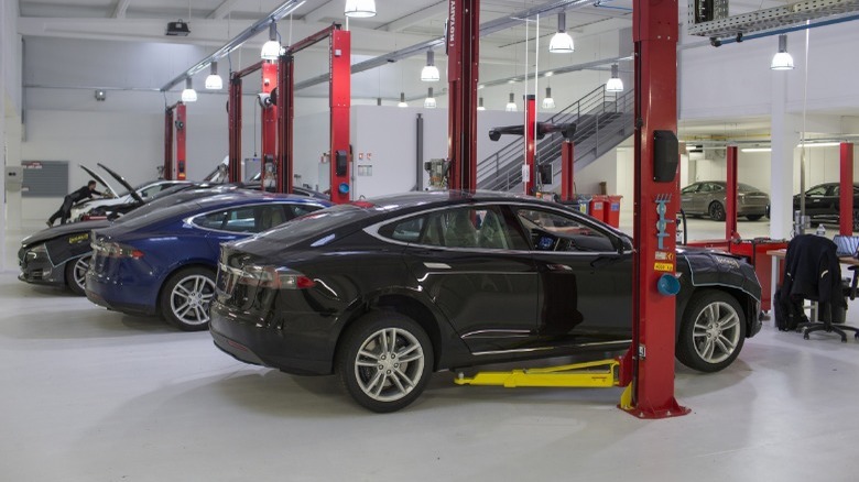 tesla service center with vehicles