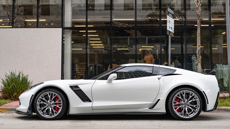 Chevrolet C7 Corvette parked outside store, left-side view