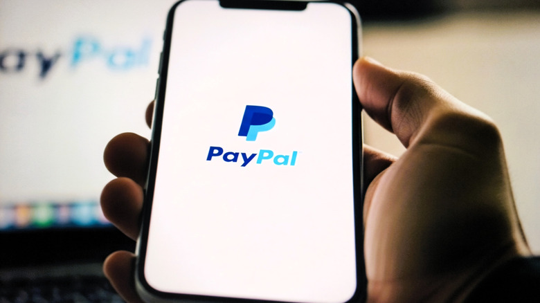 Person using PayPal app on their mobile device