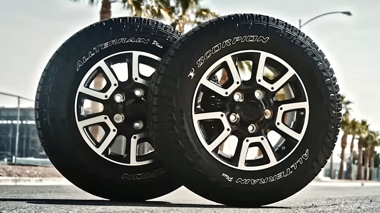 Pirelli Scorpion All Terrain tires standing vertically on a road