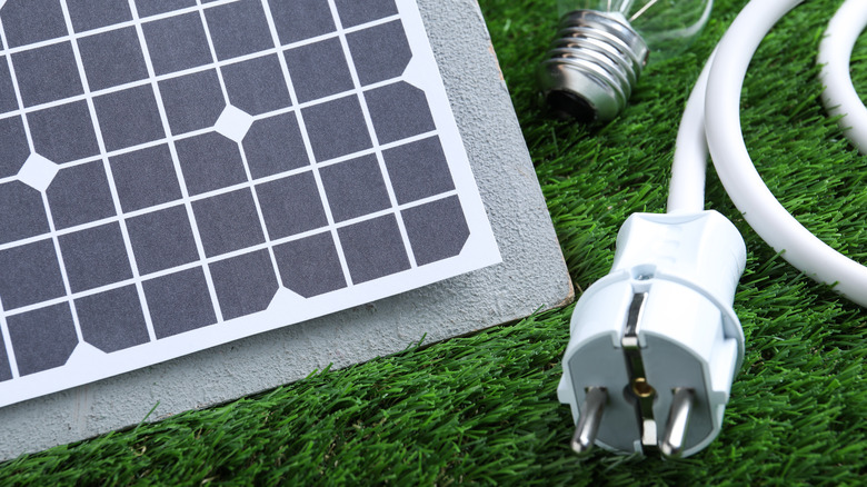 solar panel with plug and lightbulb