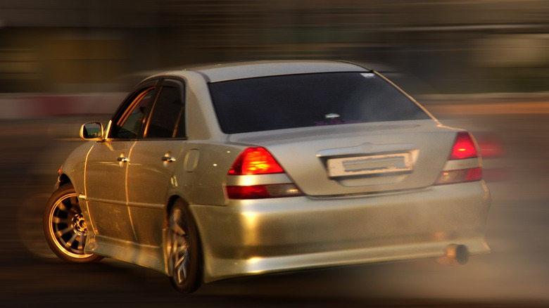 A car speeding with a blurry background.