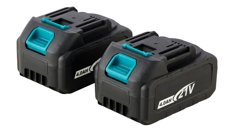 Two black and teal rechargeable battery packs with 4.0AH capacity and 21V voltage