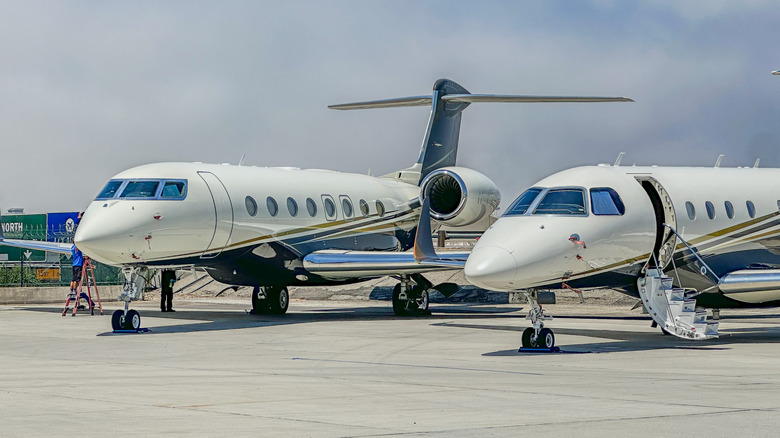 two private jets on the tarmac