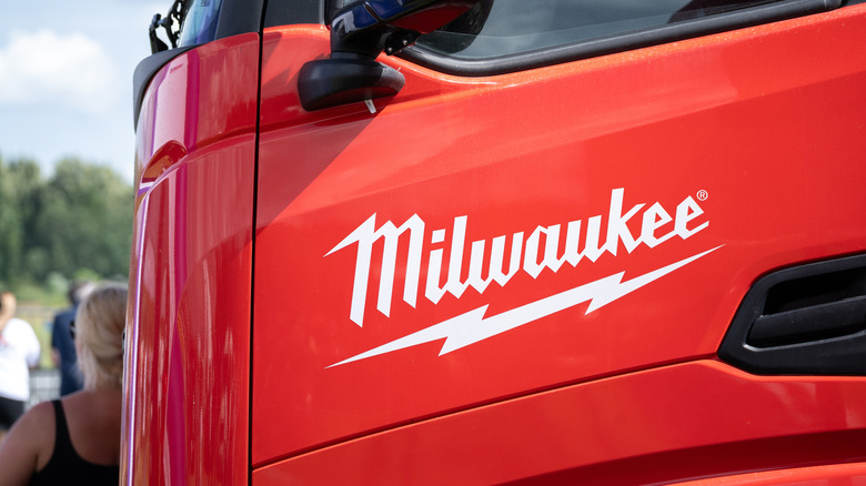 Milwaukee Tools logo on side of red bus