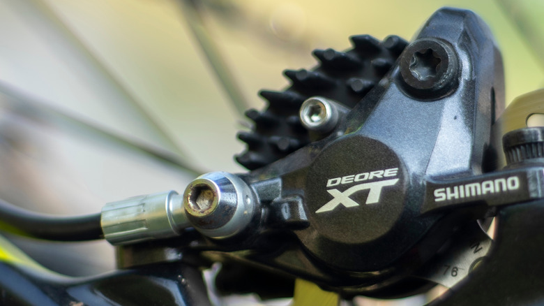 An ultra close up shot of the Shimano XT brakes callipers.