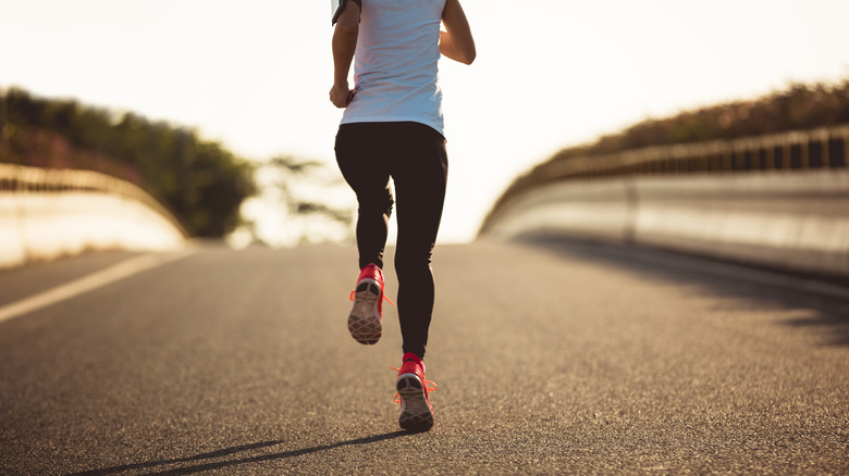 Running woman on road