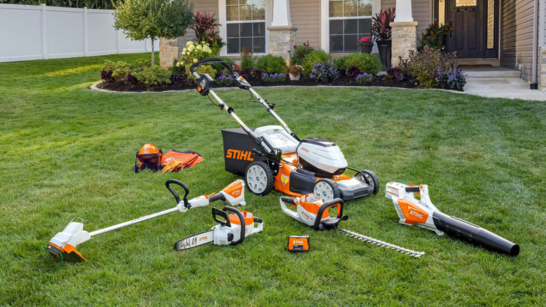 Stihl outdoor battery tools laid out on the yard