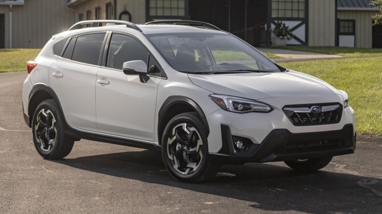 2021 Subaru Crosstrek  parked on a paved surface in front of a building