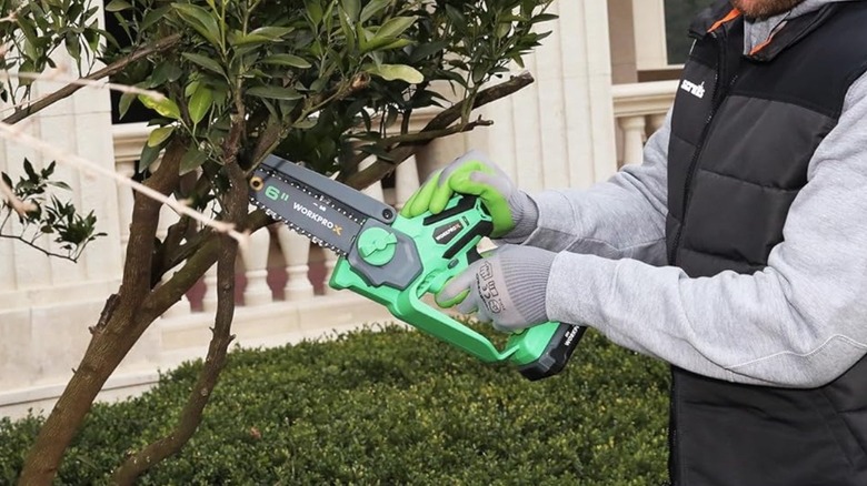 Person using WORKPROX USB chainsaw