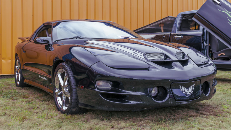 Fourth generation black Pontiac Trans Am at car show