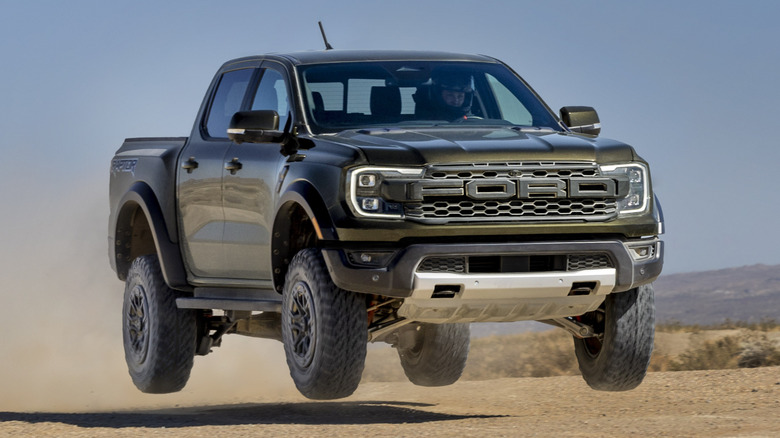 Front 3/4 view of Ford Ranger Raptor in mid-air in the desert