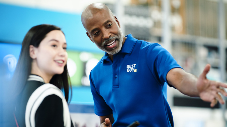 A Best Buy employee helping a customer