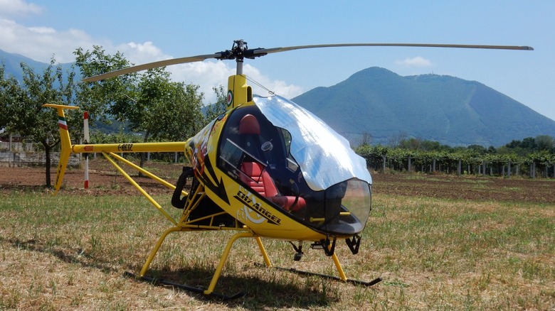 Yellow helicopter in a clearing