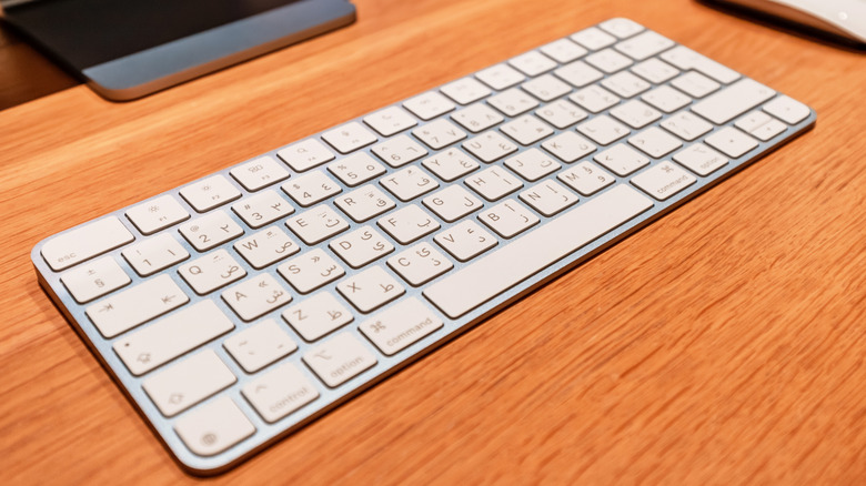An Apple Magic keyboard on a table.