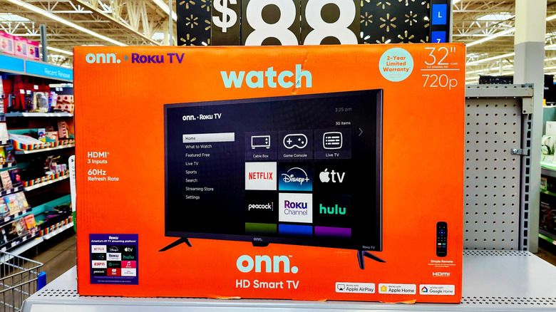 A Onn-branded Roku TV displayed at the center of the appliance section at a Walmart store.