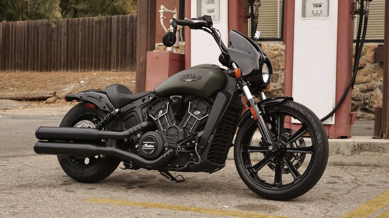 2024 Indian Scout Rogue parked in front of gas pumps