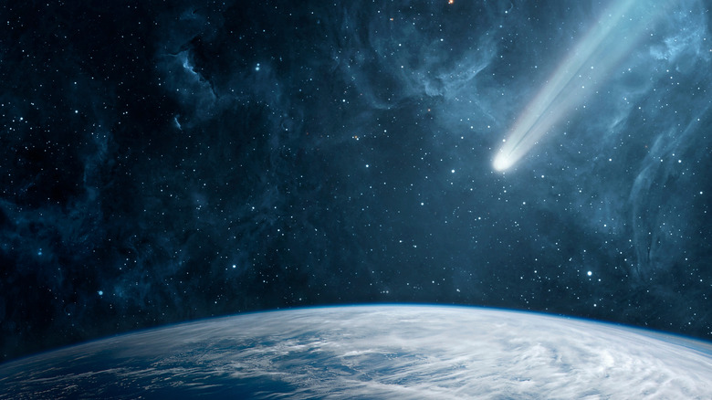 A comet with a glowing tail flying over Earth