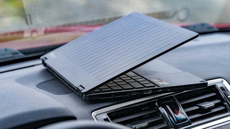 The ASUS GoPro laptop on the dashboard of a car.