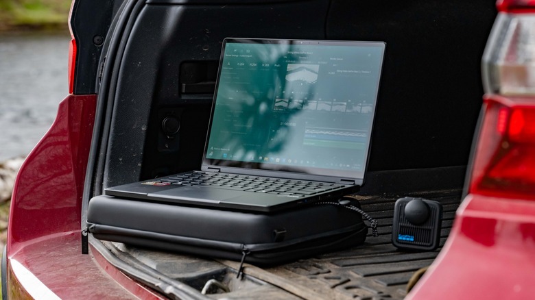 The ASUS GoPro laptop in the back of an SUV.