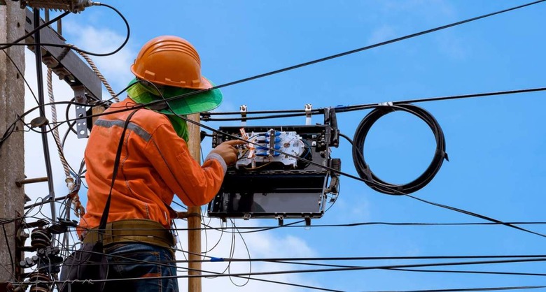 Technician installing fiber-optic cables  