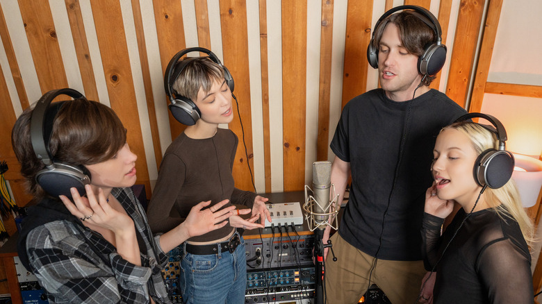Musicians each using LCD-S20 during a recording session