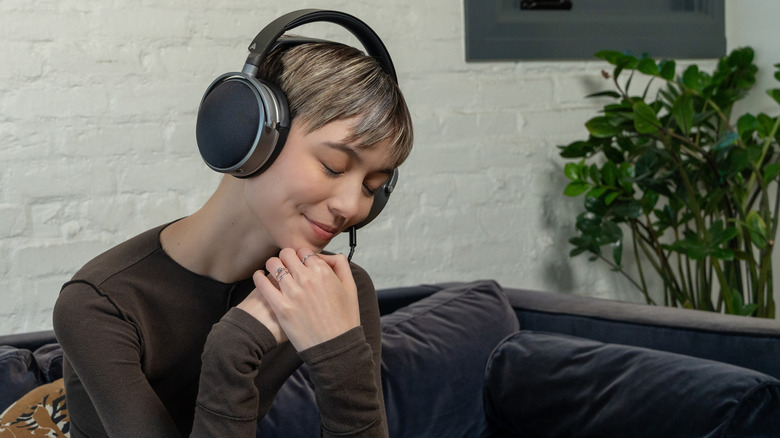 Person listening to LCD-S20 on a sofa
