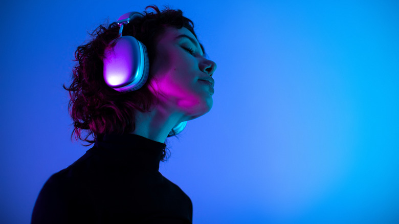 Someone listening to music through headphones.