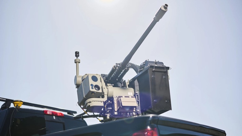 Integrated EOS Apollo laser weapon mounted on rear truck bed