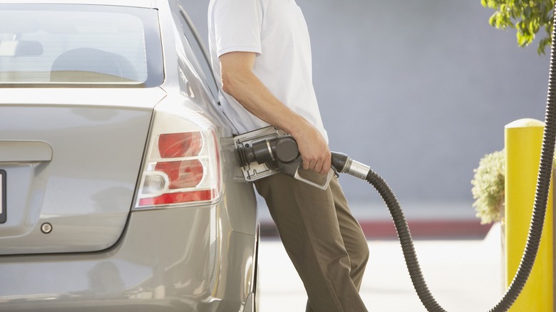 Man using gas pump
