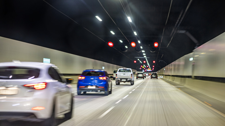 A row of cars driving too closely on the highway