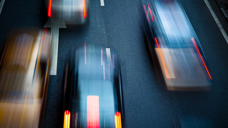 Blurred image of cars driving too closely behind one another