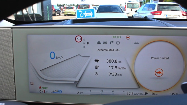 An electric vehicle dashboard display showing Power limited mode with a turtle icon.