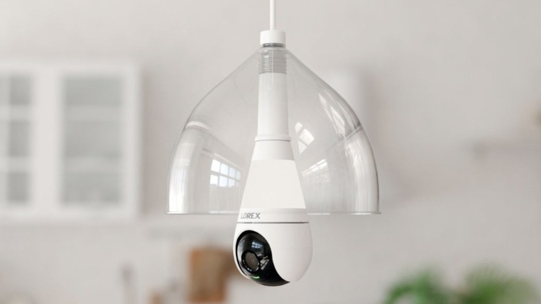 Lightbulb positioned in a clear light fixture