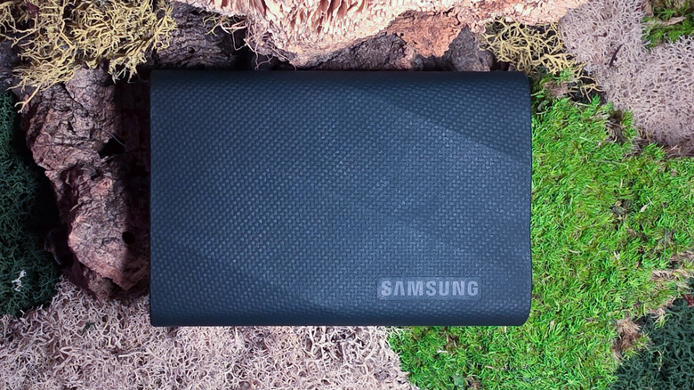 Samsung T9 SSD on mossy background