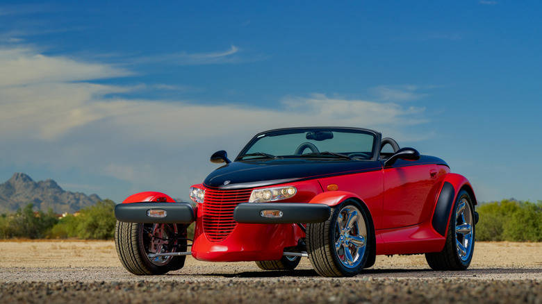 Plymouth Prowler with red and black two-tone paint parked in the desert