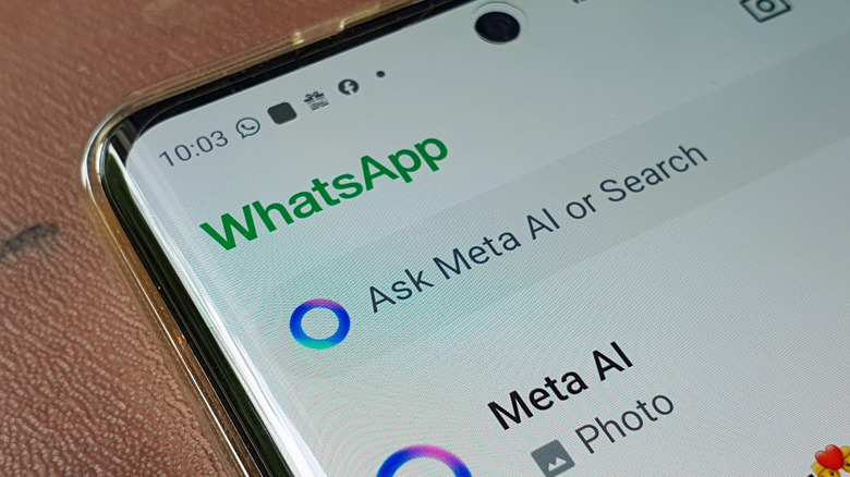 Person using Meta AI chatbot within WhatsApp