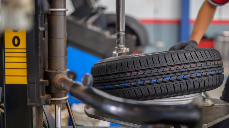 Mechanic changing a car tire