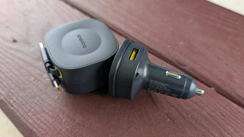 Baseus PrimeTrip VR2 Max on a wooden bench showing the USB-A port.
