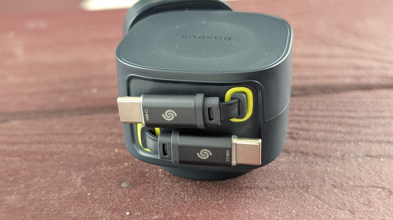 Baseus PrimeTrip VR2 Max USB-C cables retracted on a wooden bench.