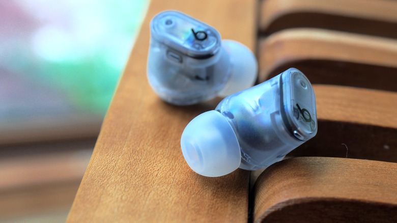 Beats Studio Buds+ on wood