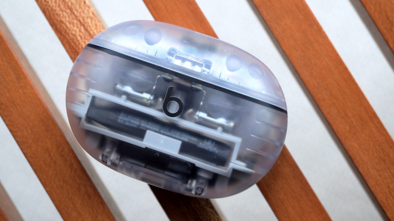 Beats Studio Buds+ on wood slats