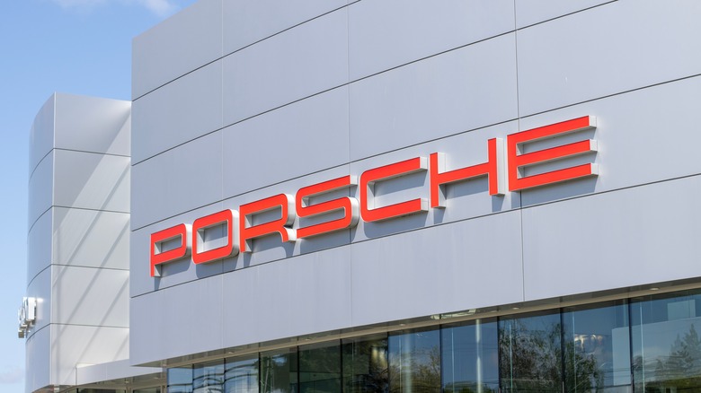 Porsche dealership with a closeup of the Porsche logo