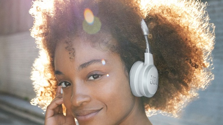Woman wearing JBL Live 460NC headphones