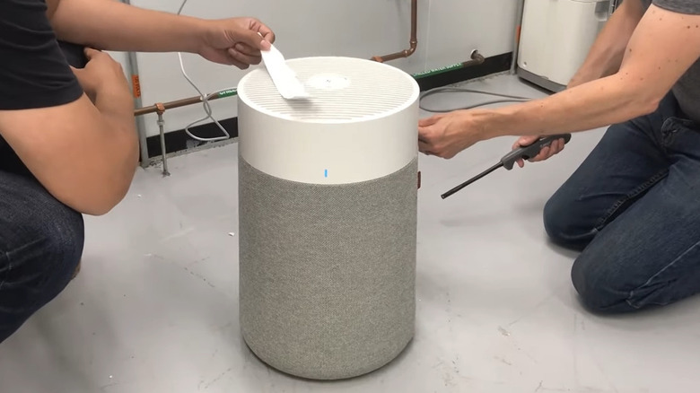 Two guys testing air purifier