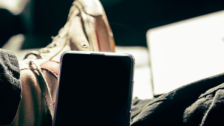 phone propped up on shoes