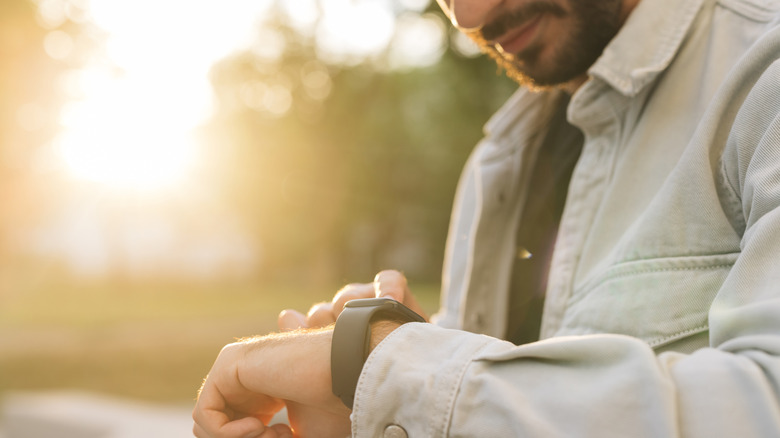 man using apple watch
