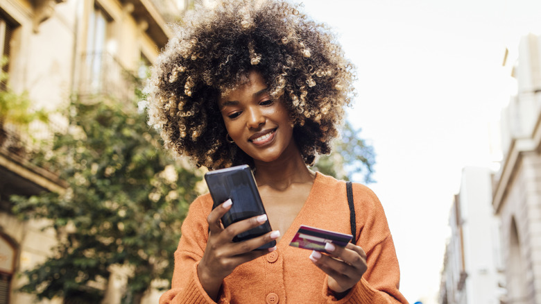 woman shopping online in street