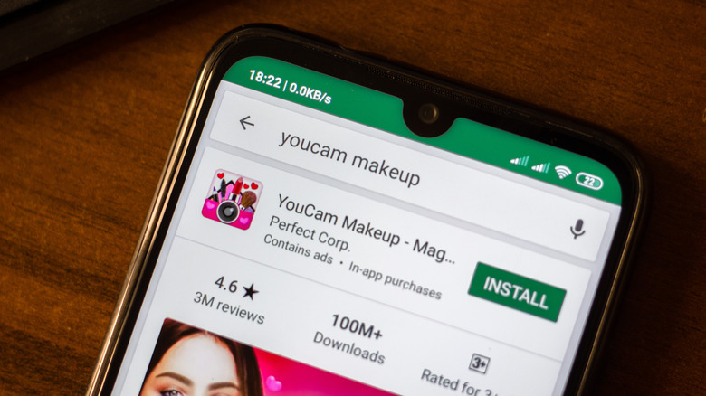 YouCam Makeup app on smartphone